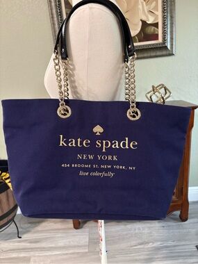 kate spade navy canvas tote with gold logo and chain handles